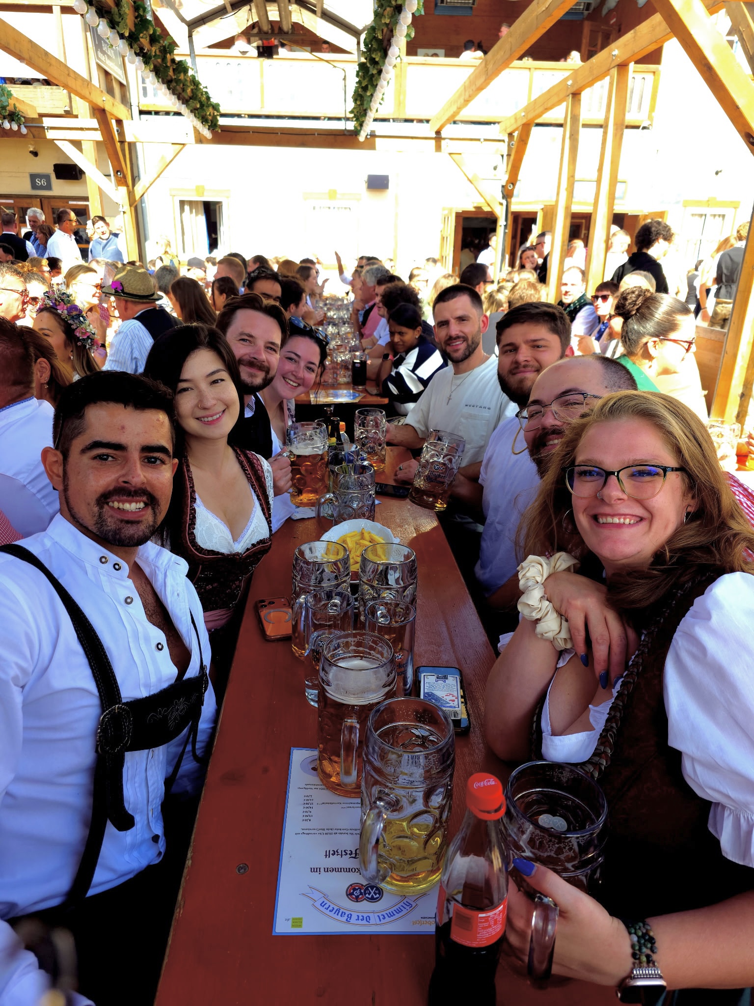 Town Takeover travelers gathered around a table at Oktoberfest